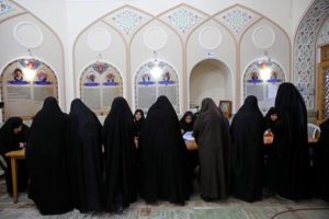 Iranian women vote in the parliamentary and Experts Assembly elections at a polling station in Qom, 125 kilometers (78 miles) south of the capital Tehran, Iran, Friday, Feb. 26, 2016. Iranians across the Islamic Republic voted Friday in the country's first election since its landmark nuclear deal with world powers, deciding whether to further empower its moderate president or side with hard-liners long suspicious of the West. The election for Iran's parliament and a clerical body known as the Assembly of Experts hinges on both the policies of President Hassan Rouhani, as well as Iranians worries about the country's economy, long battered by international sanctions. (ANSA/AP Photo/Ebrahim Noroozi)