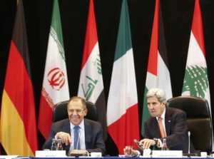 U.S. Secretary of State John Kerry, right, and Russian Foreign Minister Sergey Lavrov, left, attend the International Syria Support Group (ISSG) meeting in Munich, Germany, Thursday Feb. 11, 2016, together with members of the Syrian opposition and other officials. (Michael Dalder/Pool Photo via AP)