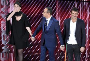 Italian host Carlo Conti (C) with Italian singers Miele (L) and Francesco Gabbani (R) on stage during the Sanremo Italian Song Festival at the Ariston theater in Sanremo, Italy, 11 February 2016. The 66th Festival della Canzone Italiana runs from 09 to 13 February. ANSA/CLAUDIO ONORATI