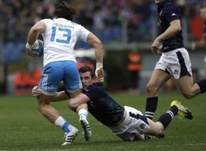 Italys Michele Campagnaro, left, and Scotlands Mark Bennett compete for the ball during a Six Nations rugby union international match between Italy and Scotland, in Rome, Saturday, Feb. 27, 2016. (ANSA/AP Photo/Alessandra Tarantino)