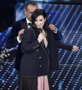 Italian host Carlo Conti with Italian singer Laura Pausini on stage during the Sanremo Italian Song Festival, at the Ariston theater in Sanremo, Italy, 09 February 2016. The 66th Festival della Canzone Italiana runs from 09 to 13 February. ANSA/CLAUDIO ONORATI