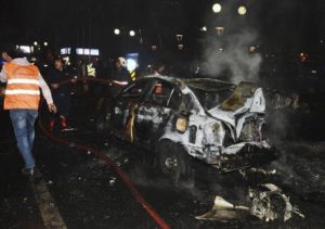 Members of emergency services work at the scene of an explosion in Ankara, Turkey, Sunday, March 13, 2016. A television channel said the bomb exploded close to bus stops near a park at Ankara's main square, Kizilay. The news channel said the explosion occurred as a car slammed into a bus, suggesting that the blast may have been caused by a car bomb. Several vehicles had caught fire, it said. (ANSA/AP Photo)