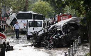 epa05349396 A general view shows police officers inspecting the site of a bomb attack to a police bus in the Vezneciler district of Istanbul, Turkey, 07 June 2016. At least five people were wounded after an explosion, caused by a bomb, targeted a police bus, local media reported. EPA/SEDAT SUNA