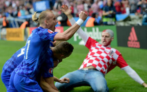 Croatia's defender Domagoj Vida (L) celebrates along side goal shooter Croatia's midfielder Luka Modric (unseen) the team's first goal during the Euro 2016 group D football match between Turkey and Croatia at Parc des Princes in Paris on June 12, 2016. / AFP / BULENT KILIC (Photo credit should read BULENT KILIC/AFP/Getty Images)