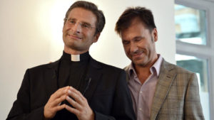 Father Krysztof Olaf Charamsa (L), who works for a Vatican office, gives a press conference with his partner Edouard to reveal his homosexuality on October 3, 2015 in Rome. The priest said he wanted to challenge what he termed the Church's "paranoia" with regard to sexual minorities, claiming the Catholic clergy was largely made up of intensely homophobic homosexuals. The Vatican condemned the coming out of a Polish priest on the eve of a major synod as a "very serious and irresponsible," act which meant he would be stripped of his responsibilities in the Church's hierarchy. In a statement, a spokesman said Krzystof Charamsa would not be able to continue in his senior position in the Vatican and that his future as a priest would be decided by his local bishop. AFP PHOTO / TIZIANA FABI (Photo credit should read TIZIANA FABI/AFP/Getty Images)