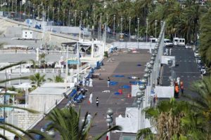 epa05425806 Crime scene investigators work on the 'Promenade des Anglais' after the truck crashed into the crowd during the Bastille Day celebrations in Nice, France, 15 July 2016. French government announce a three days of national mourning after the attack in Nice. According to reports, at least 84 people died and many were wounded after a truck drove into the crowd on the famous Promenade des Anglais during celebrations of Bastille Day in Nice, late 14 July. Anti-terrorism police took over the investigation in the incident, media added. EPA/OLIVIER ANRIGO