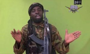 FILE - In this Monday May 12, 2014 file photo taken from video by Nigeria's Boko Haram terrorist network, shows their leader Abubakar Shekau speaking to the camera. the The military said Tuesday, Aug. 23, 2016, that Boko Haram leader Abubakar Shekau is believed to have been fatally wounded in an airstrike while he was praying in a forest stronghold in northeast Nigeria. (ANSA/AP Photo/File)