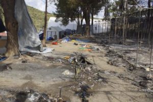 epa05548945 Burnt tents following clashes between groups of refugees and migrants of different nationalities at the camp of Moria on Lesvos (Lesbos) island, Greece, 20 September 2016. Migrants set fire to several parts of the camp which then spread causing hundreds of people to flee. Authorities evacuated the area where unaccompanied minors were living and transferred them to a new facility. Earlier today, rumours that mass returns to Turkey were imminent prompted renewed incidents and a break-out from the hotspot who attempted to set off on a protest march to Mytilene, the island's main town, but were stopped and forced to turn back by police. EPA/STRATIS BALASKAS
