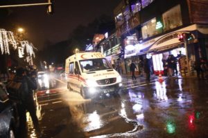 An ambulance rushes from the scene of an attack in Istanbul, early Sunday, Jan. 1, 2017. Turkey's state-run news agency said an armed assailant has opened fire at a nightclub in Istanbul during New Year's celebrations. (ANSA/AP Photo/Halit Onur Sandal) [CopyrightNotice: Copyright 2017 The Associated Press. All rights reserved.]