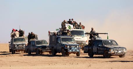 Members of Iraqi Shiite Badr Army militia on their way to take part in a military operation near Tal Afar military airport