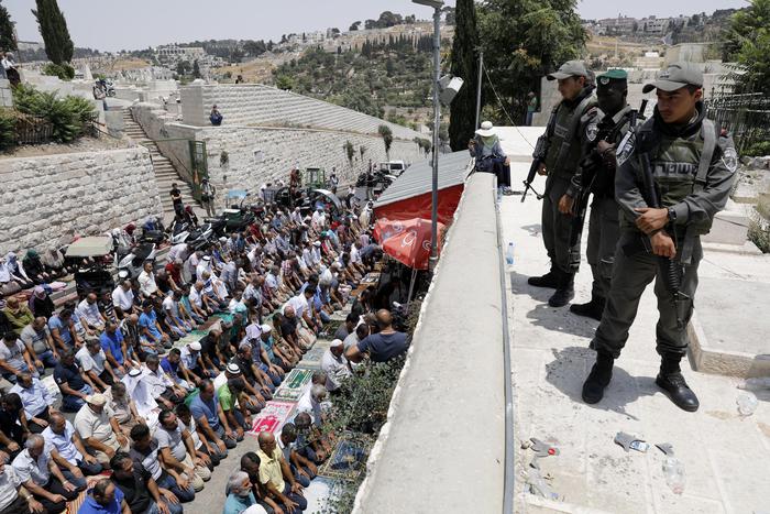 Palestinians protest against security measures at the Al-Aqsa Mosque
