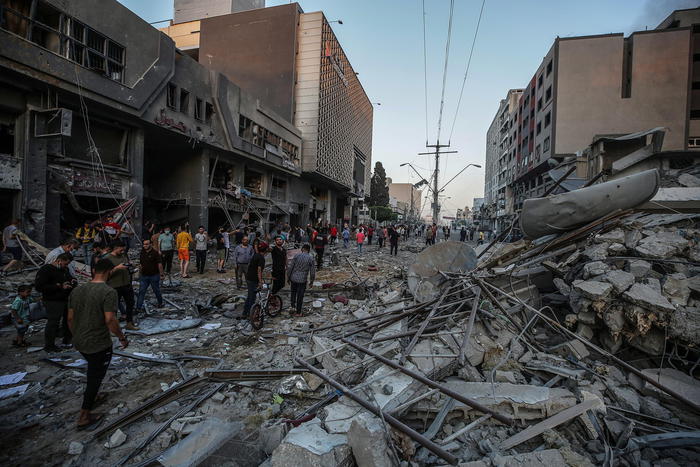 Smoke and flames rise after an Israeli strike Al-Shorouq tower in Gaza City